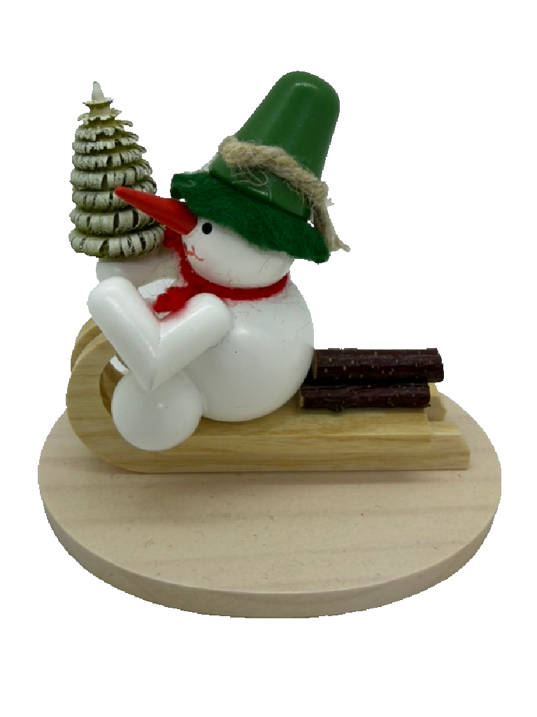 Schneemann auf Holzschlitten